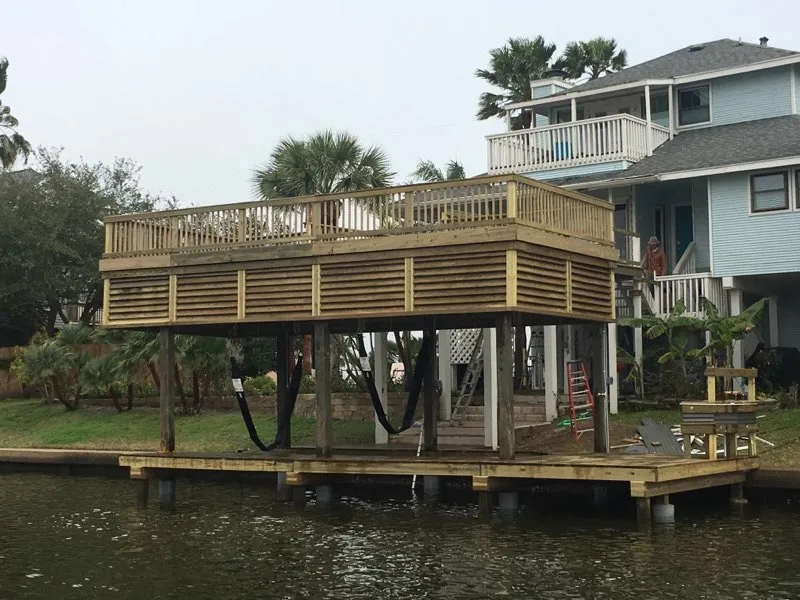 boathouse with deck and dock