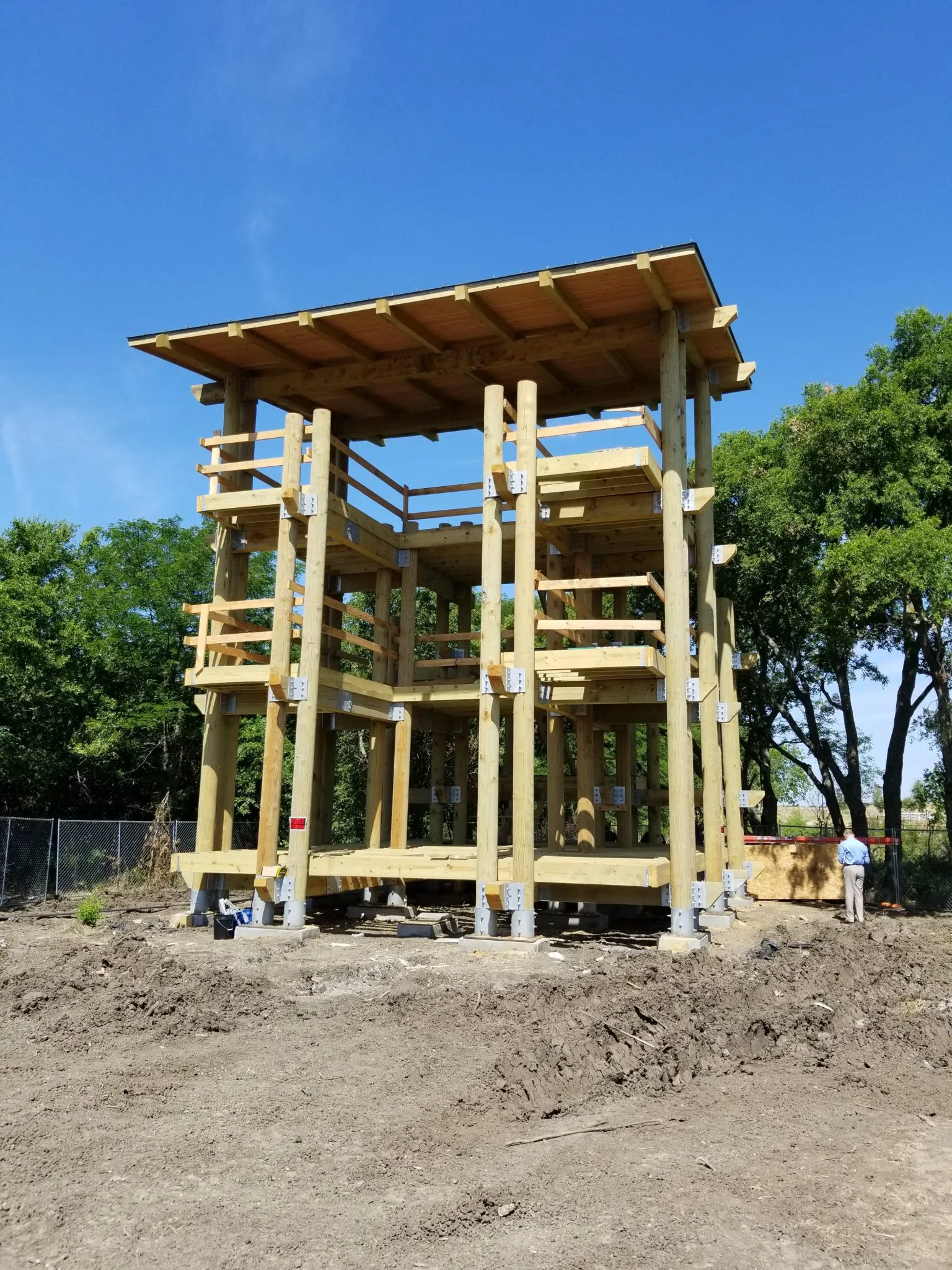 play structure constructed with gun barrel pilings