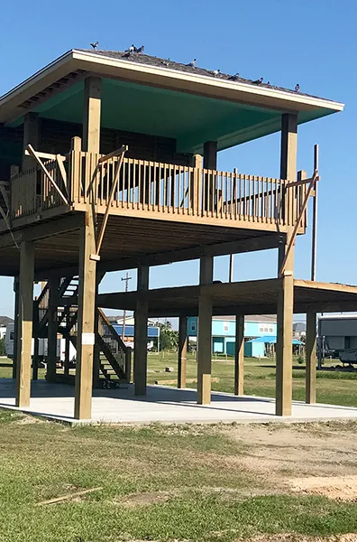 wood pilings on beach home