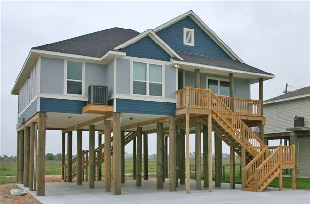 beach house gun barrel pilings finished
