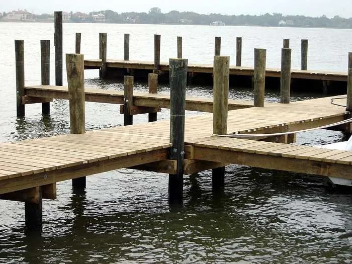 dock and pier built with pressure treated pilings for marine use.