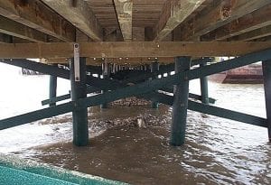 polymer coated pier pilings cross beams