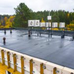 Rooftop view of mass timber building with massive wood beams