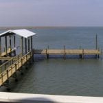 Custom boathouse pier built with American Pole & Timber pressure treated lumber
