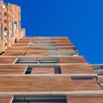 Mass timber facade in modern building with cross laminated timber.