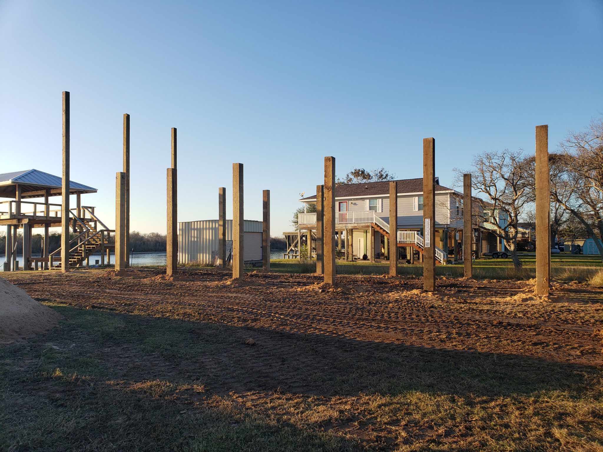 installed treated timber beach home foundation pilings