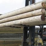 wood poles on fork lift BIG